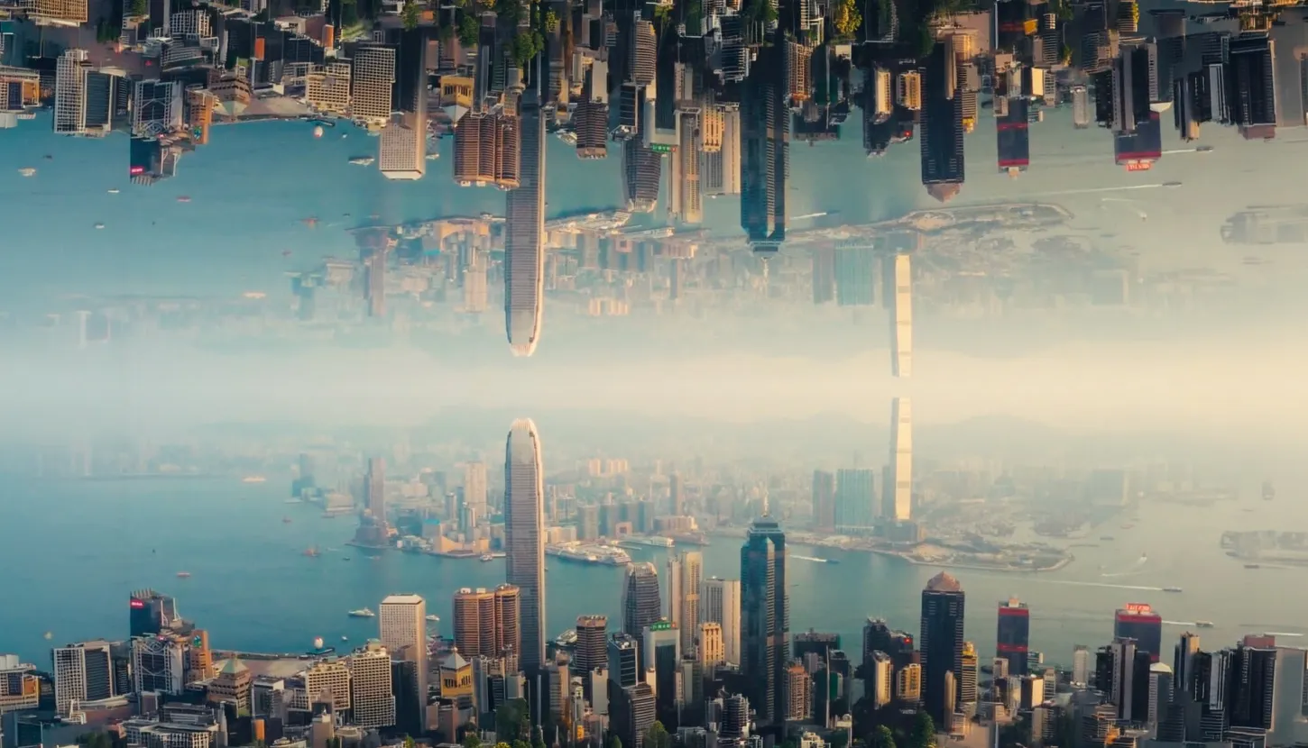 A mega city being shown in aerial view and mirrored upside down