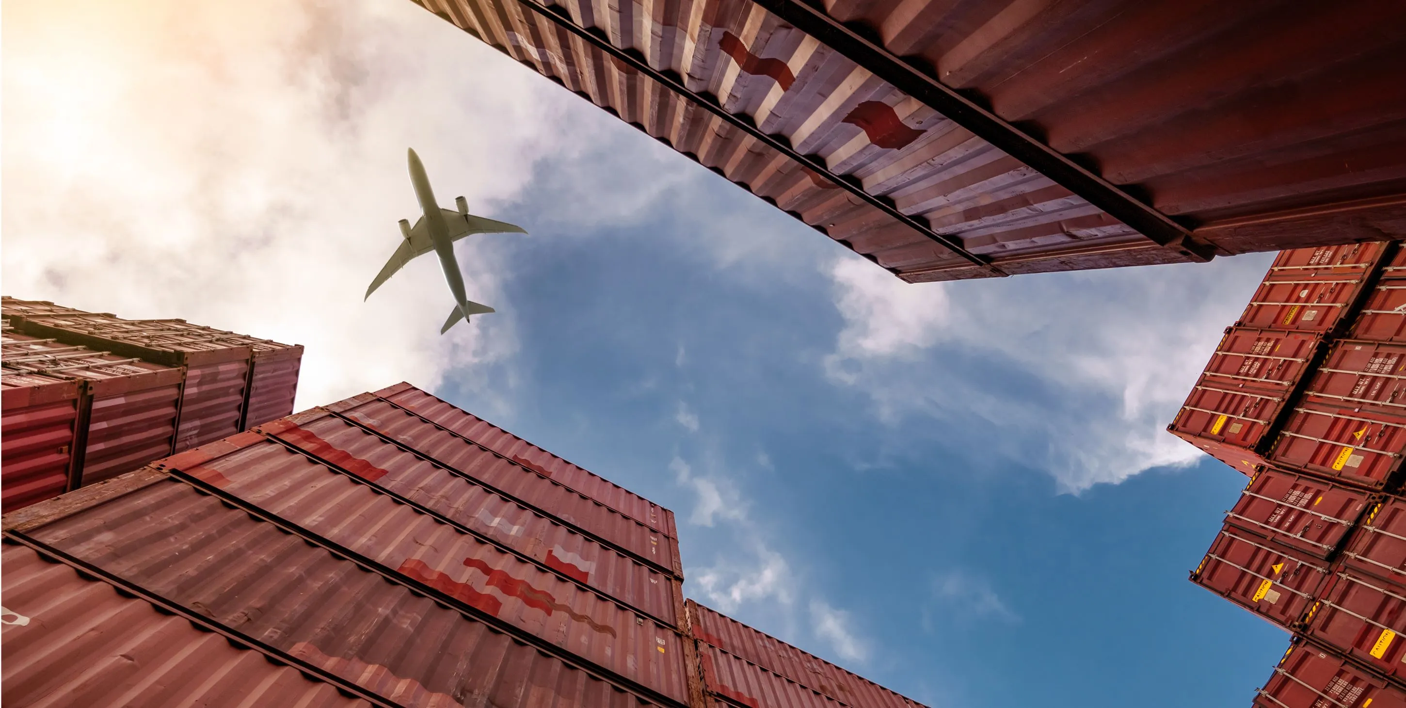 Plane above containers