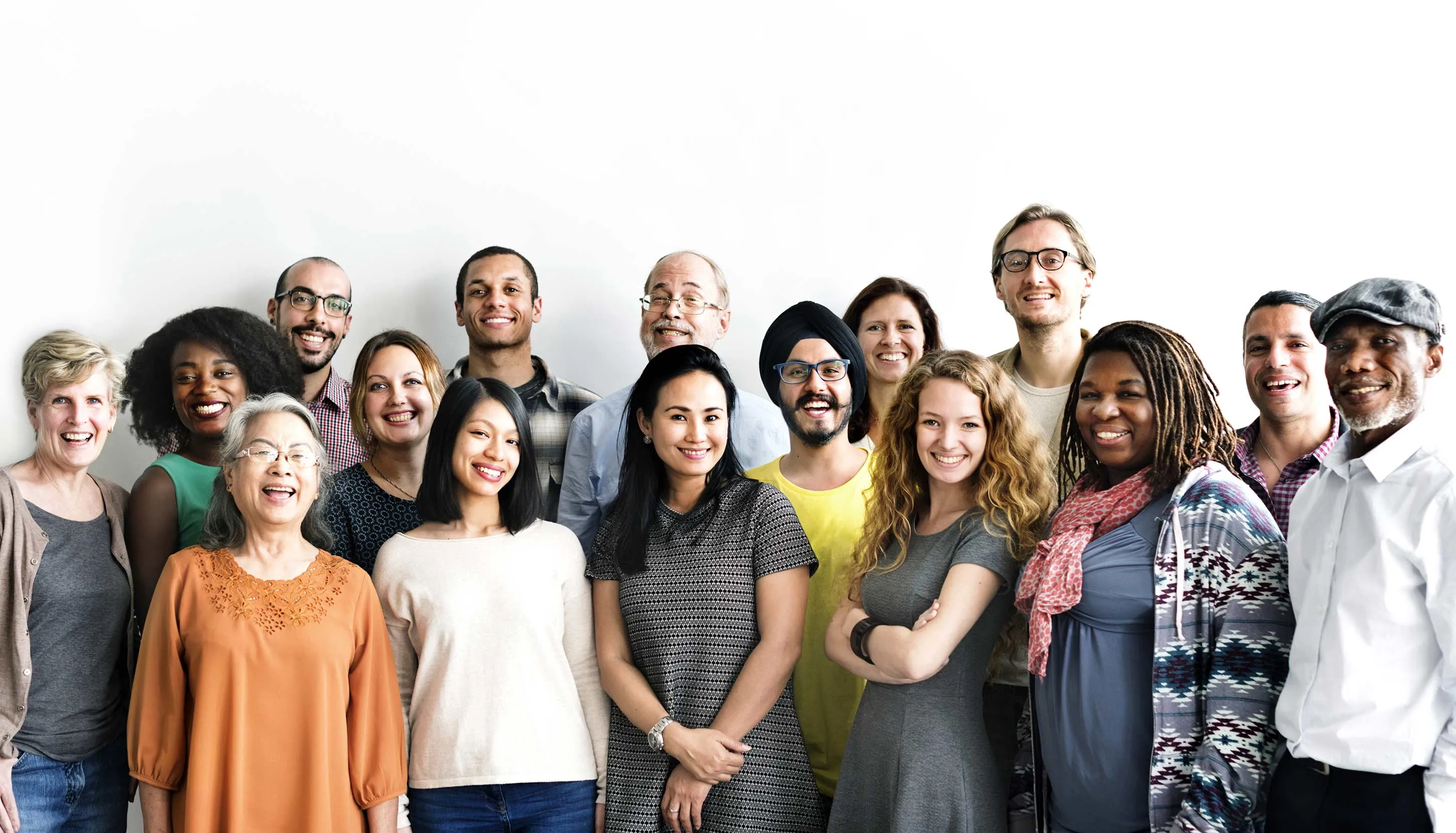 A diverse group of people in fron of a white background